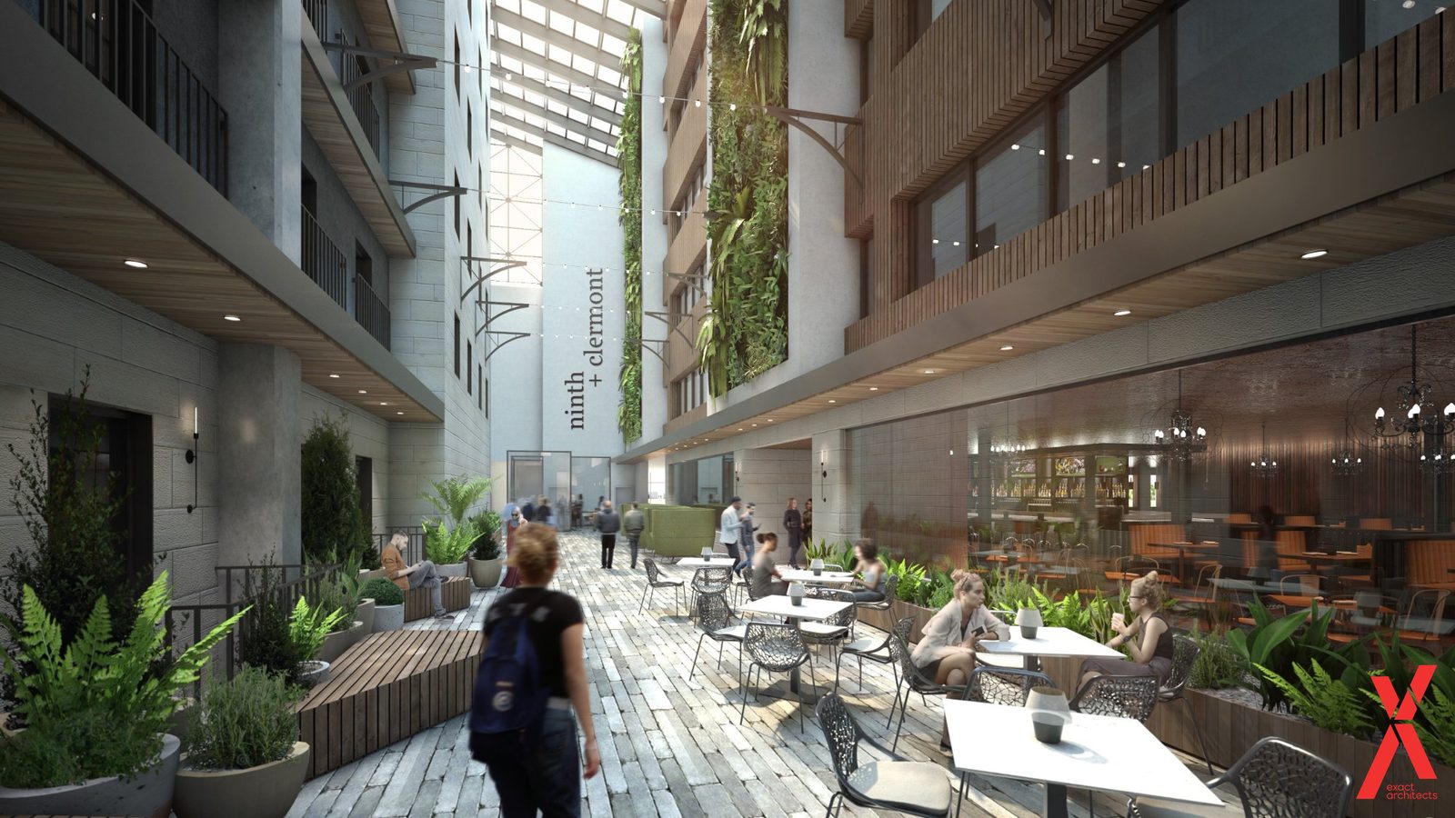 The campus atrium as designed, daylit the full height with planting and cafe seating at the floor