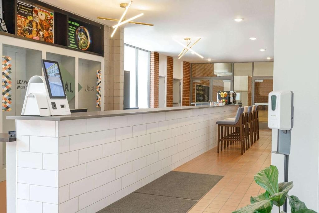 The lobby and market at the Leavenworth Local, with a long tiled reception counter and a breakfast bar beyond